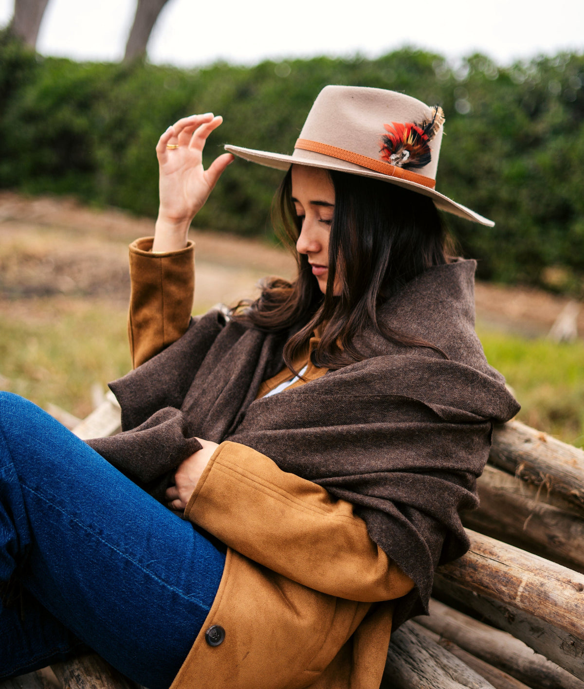 Vicuña brown baby alpaca throw worn on a eucalyptus log
